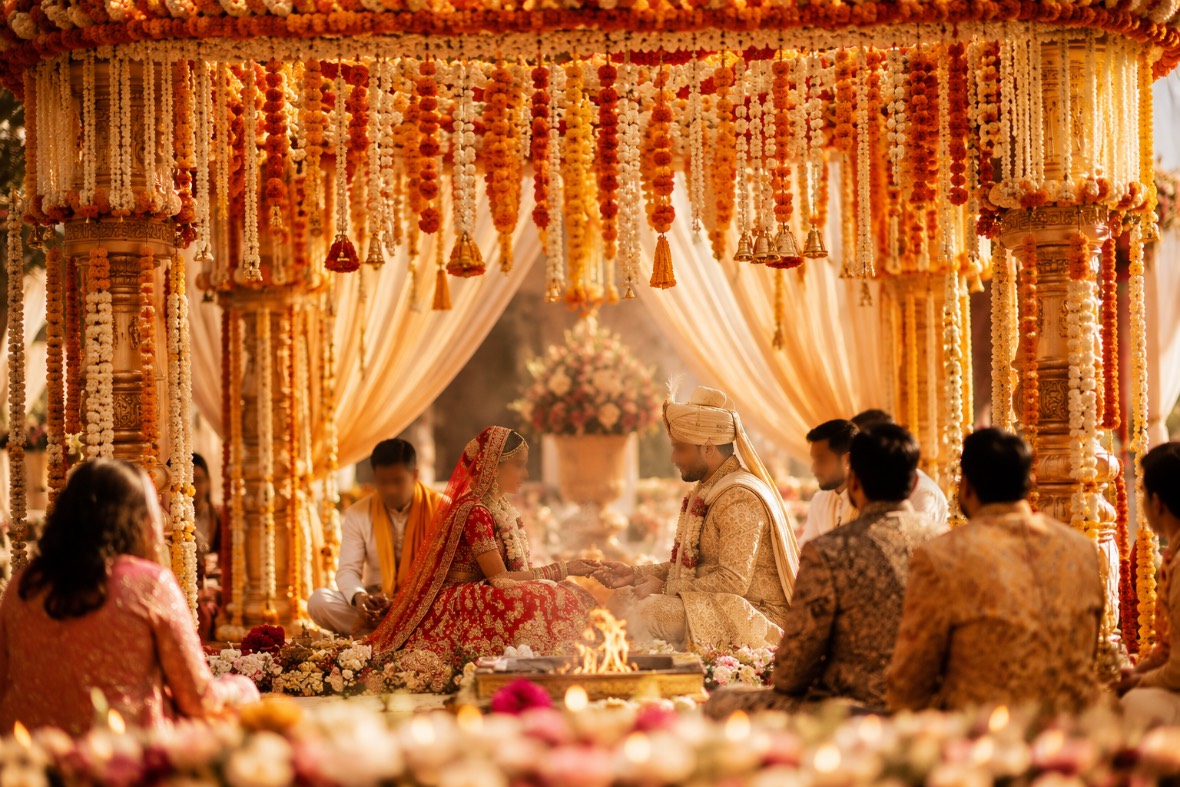 A wedding ceremony mid-ritual, guests gathered close